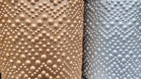 Close-up of a pile of gray and white decorative stools