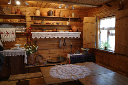 Interior of a rustic country house with wooden furniture and utensilsの写真素材