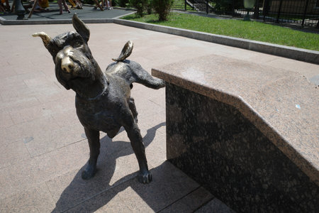 Bronze statue of a bull on the ground in the park.のeditorial素材
