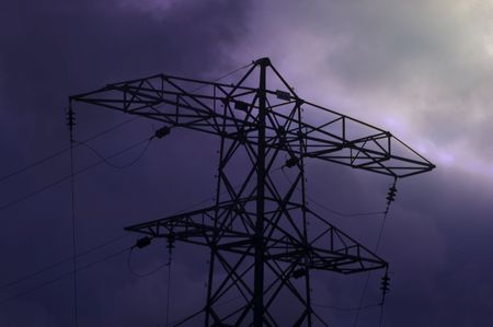 An electricity pylon in the twilight bathed in moonlightの写真素材