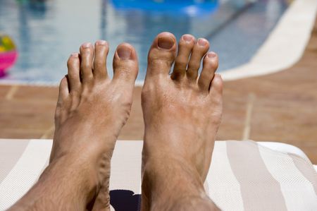 A pair of feet relaxing on holiday