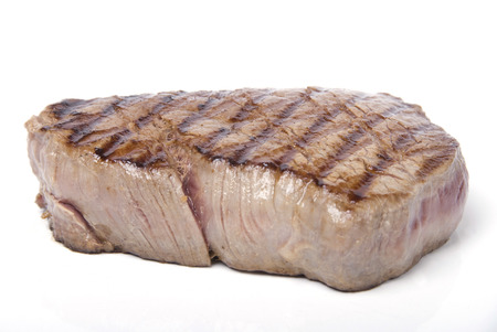 A piece of lovely fillet steak shot against a white backgroundの写真素材