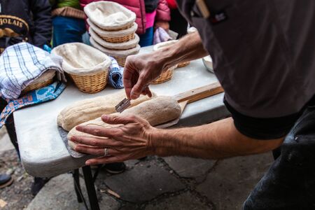 Pictures taken during a bread and pizza making workshop with many people from all ages and...