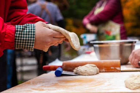 Pictures taken during a bread and pizza making workshop with many people from all ages and...