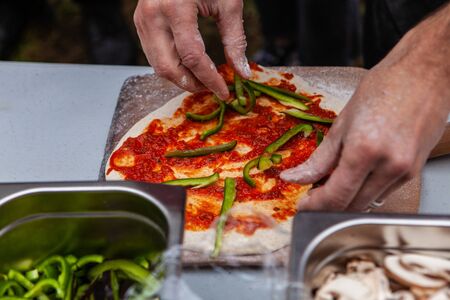 Pictures taken during a bread and pizza making workshop with many people from all ages and...