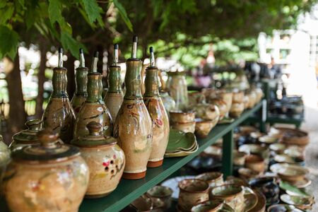 Display full of pottery items including pitchers, pots, bowls, teapots and jugs