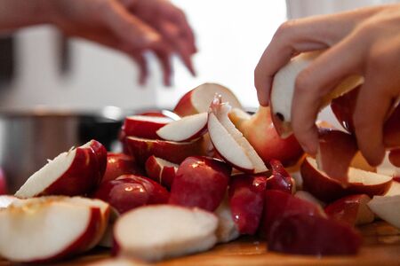 Closeup picture taken as part of an apple cider making workshop, in an indoors family environment