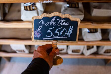 Close up of chalk hand writen backboard and wood sign at maket. Market labels for showing the price...