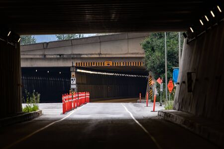Caution, warning traffic cones at the tunnel exit of the highway. Engineering construction for...