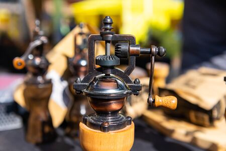 A closeup view of high quality handcrafted salt and pepper mills sold on a stall during a market celebrating local artisans and producers.の写真素材