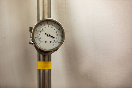 Pressure measurement analogue gauge meter in psi and kPa, vacuum gauges manometer, selective focus close up view, with a broken needleの写真素材
