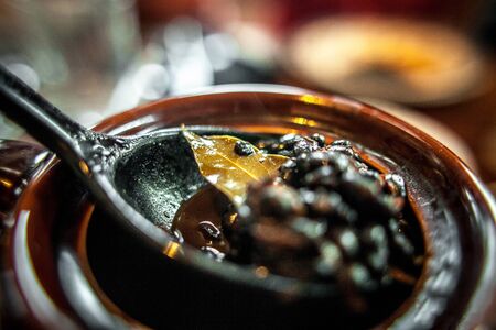 Top view macro shot of sweet vegetarian healthy Indian jam with fruits.Selective focus of full opened jar with high end chutney with fresh fruits.の写真素材