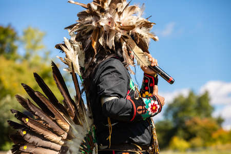 Outaouais, Quebec - September 19, 2020: Unrecognized person performing in cultural fiesta wearing...