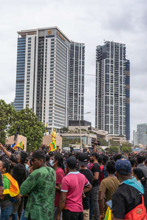 COLOMBO, SRI LANKA: 9th July 2022: Hundreds of activists gather near the One Galle Face high rise buildings during protest against government regime.のeditorial素材