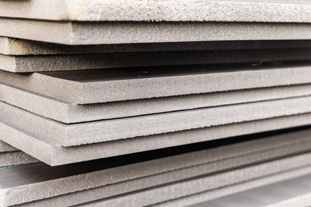 Many sheets of rigid xps extruded polystyrene insulation boards are stacked and ready for use at a...