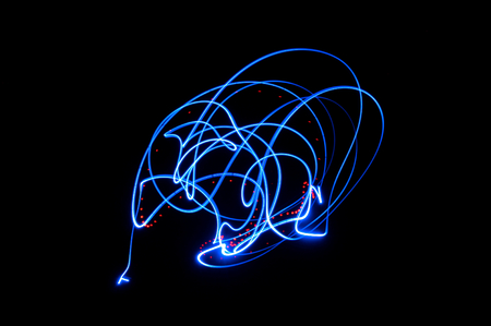 Skull shaped light painting. Sharp blue lines on black backgroundの写真素材