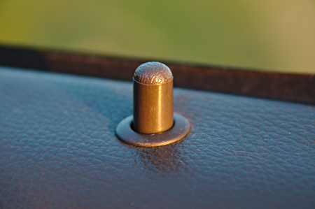 Door locking / unlocking knob of a car door.の写真素材