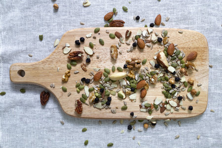 Nuts on a serving board, top view, top view.の写真素材