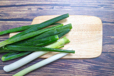 Green onions on the table, top view, top view.の写真素材