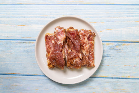 Pre-baked meat on a plate.の写真素材