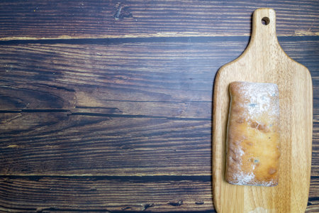 Chiabatta on the serving board, top view, top view.の写真素材