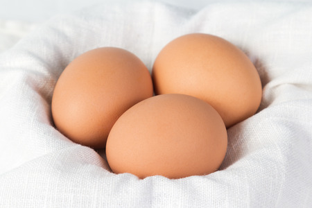 Boiled chicken eggs lying on a napkinの写真素材