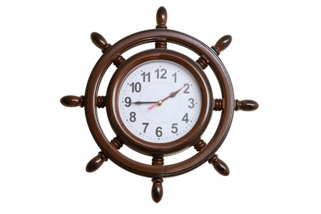 Wall clocks in the form of marine steering wheel isolated on whiteの写真素材