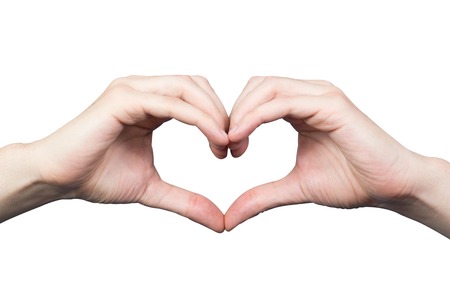 Men's hands in the shape of a heart isolated on white backgroundの写真素材