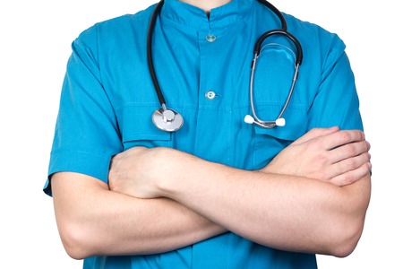 Portrait of unknown male surgeon doctor holding his stethoscope, crossed armsの写真素材