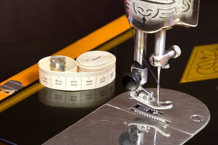 The Old black sewing machine wiht soft meter on itの写真素材