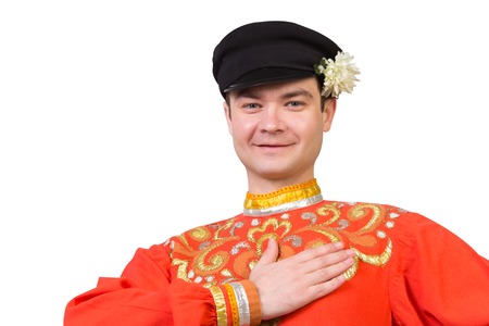 attractive russian guy in folk costume isolated on whiteの写真素材