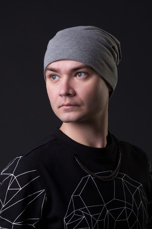 Portrait of a young hipster guy, studio pictureの写真素材