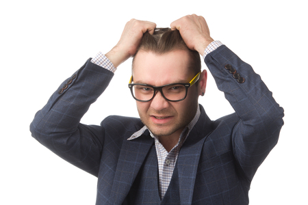 Young businessman frustrated, isolated on white backgroundの写真素材