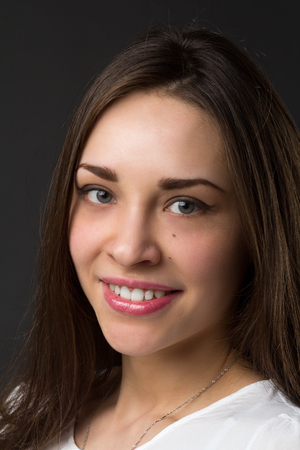 portrait of a young beautiful smiling girl, studio pictureの写真素材