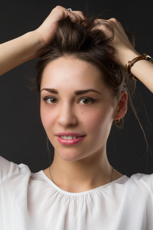 portrait of a young beautiful smiling girl, studio pictureの写真素材