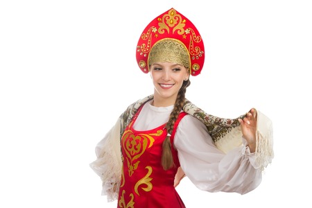 beautiful  smiling russian girl in folk costume isolated on whiteの写真素材