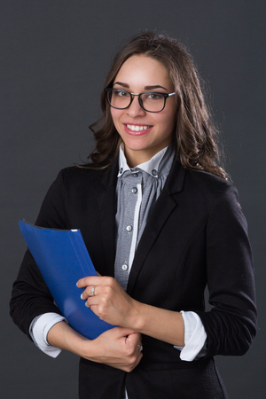 Portrait of a smiling businesswoman, studio pictureの写真素材
