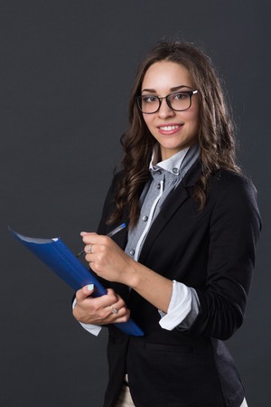 Portrait of a smiling businesswoman, studio pictureの写真素材