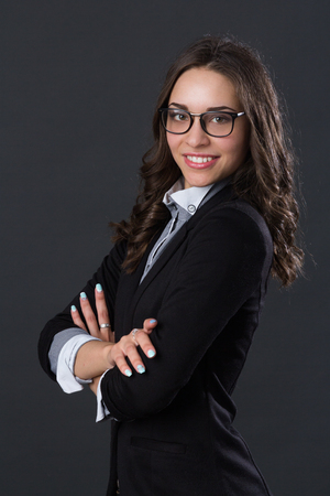 Portrait of a smiling businesswoman in glasses,の写真素材