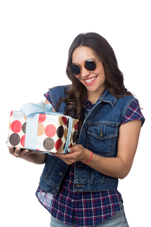 young beautiful girl holding gift isolated on white backgroundの写真素材