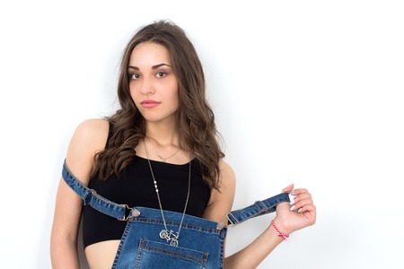 young caucasian hipster girl standing in front of the wallの写真素材