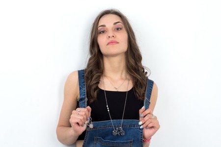 young caucasian hipster girl standing in front of the wallの写真素材