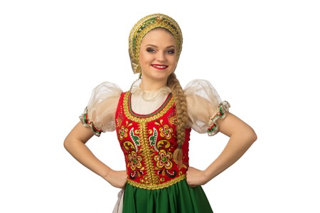 Beautiful smiling caucasian girl in russian folk costume isolated on white backgroundの写真素材