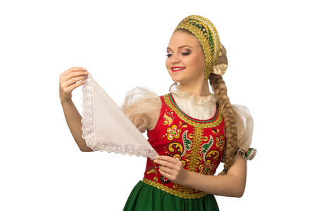 Beautiful smiling caucasian girl in russian folk costume isolated on white backgroundの写真素材