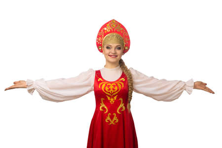 Beautiful smiling caucasian girl in russian folk costume isolated on white backgroundの写真素材