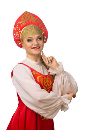Beautiful smiling caucasian girl in russian folk costume isolated on white backgroundの写真素材