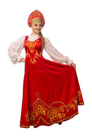 Beautiful smiling caucasian girl in russian folk costume isolated on white background. Full length.の写真素材