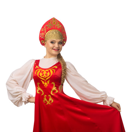 Beautiful smiling caucasian girl in russian folk costume isolated on white backgroundの写真素材
