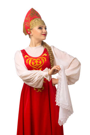Beautiful smiling caucasian girl in russian folk costume isolated on white backgroundの写真素材