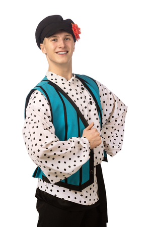 Attractive russian guy dancing in folk costume isolated on white backgroundの写真素材